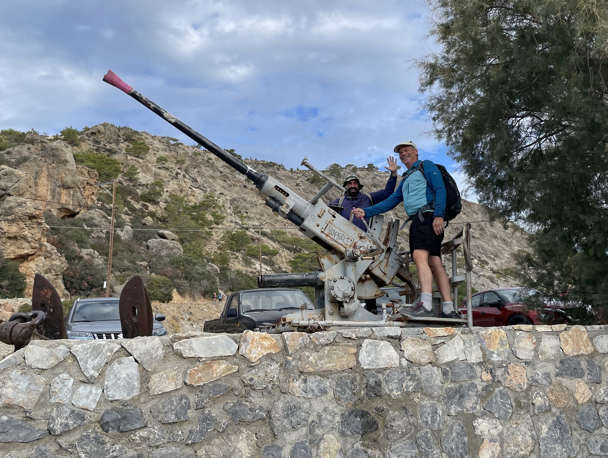 Men bonding over large guns.